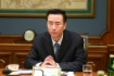 Vizepräsident der CNPC Wang Dongjin während des Treffens mit Alexey Miller