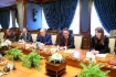 Alexey Miller (zweiter von rechts) während des Arbeitstreffens mit Wang Dongjin, Vizepräsident der CNPC